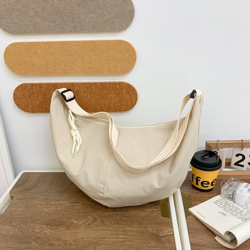 

Japanese casual literary dumpling bag women s bag ins wind small fresh nylon shoulder bag fashionable large capacity messenger bag