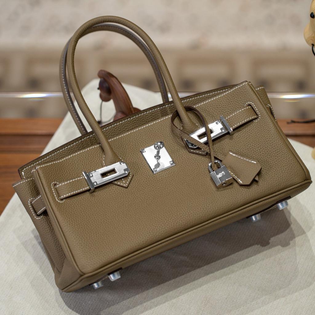 Neue lange Tragetasche Verschluss Silberschnalle Oberleder Rindsleder Mode Ein-Schulter-Handtasche Schloss Schnalle Leder Damen Tasche Handtasche