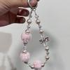 New high-end autumn and winter pom-pom mobile phone chain beaded short lanyard bag keychain pendant girl pendant