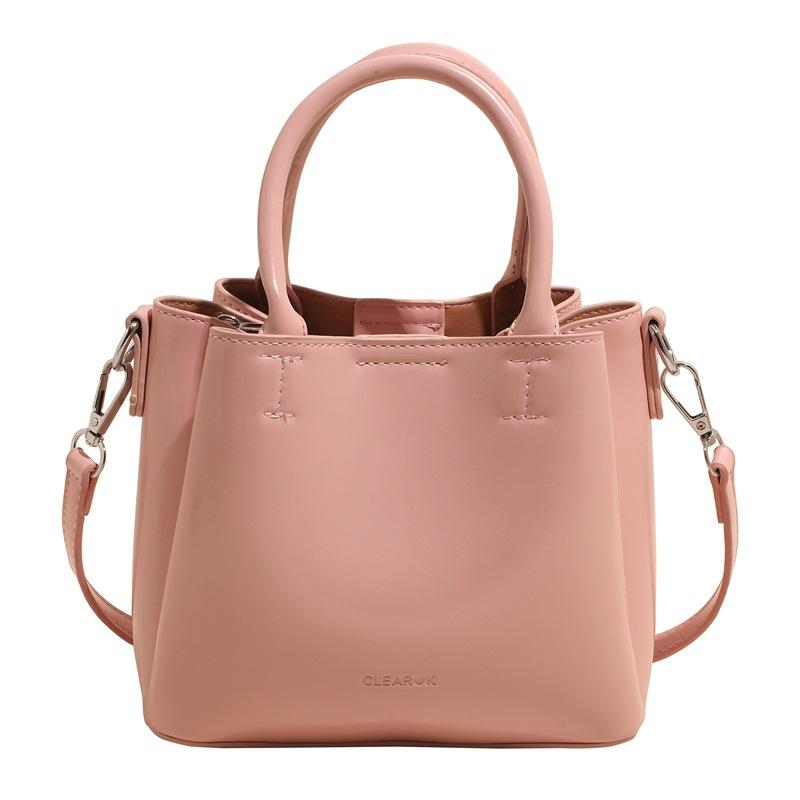 

New spring versatile oil wax leather texture hand bucket bag women commute to work versatile shoulder messenger bag