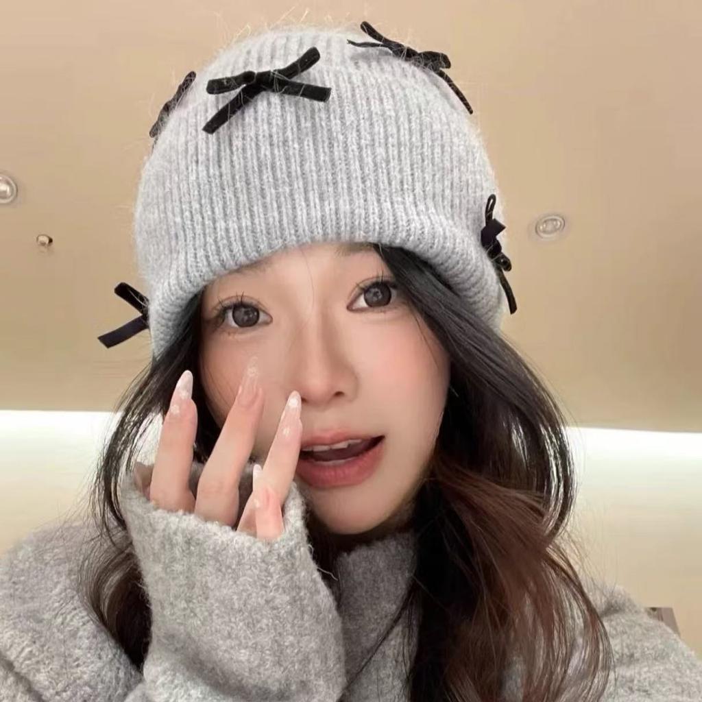 Korean ins autumn and winter warm sweet wool hat women contrasting color bow knitted ear protector face small pile hat tide