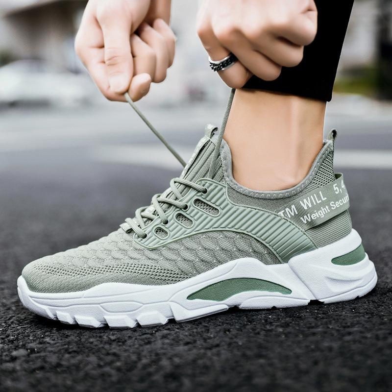2023 nuevos zapatos de hombre tejidos voladores zapatos de inyección de Color sólido tejido volador tendencia diaria zapatos de hombre de cabeza redonda baja