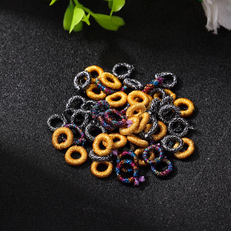 Exquisite Gold Ring with Wire Coil, Gold & Silver Buckle, and Woven Knot Ball