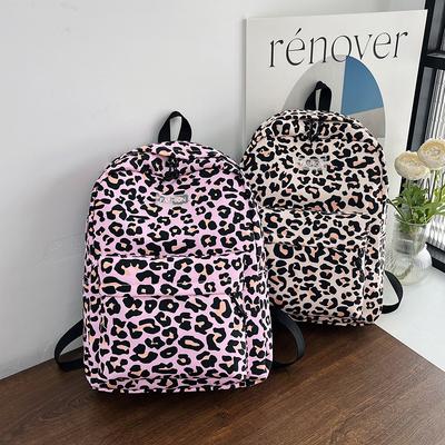 Mochila retro estilo universitario estudiantes de secundaria gran capacidad 1011 nuevo estampado de leopardo tendencia versátil mochila de cresta