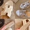 Height-increasing Ruth slippers women's summer straw woven one-word slope heel H cool slippers
