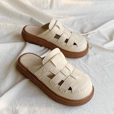 Baotou coole slippers voor dames om te dragen in de zomer van 2025 nieuwe grote neus schoenen geweven hakloos dikke zolen luie halve slippers