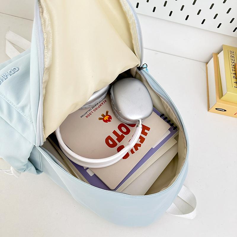 Korean high-value backpack for junior high school students, casual, simple, fashionable and versatile, large capacity