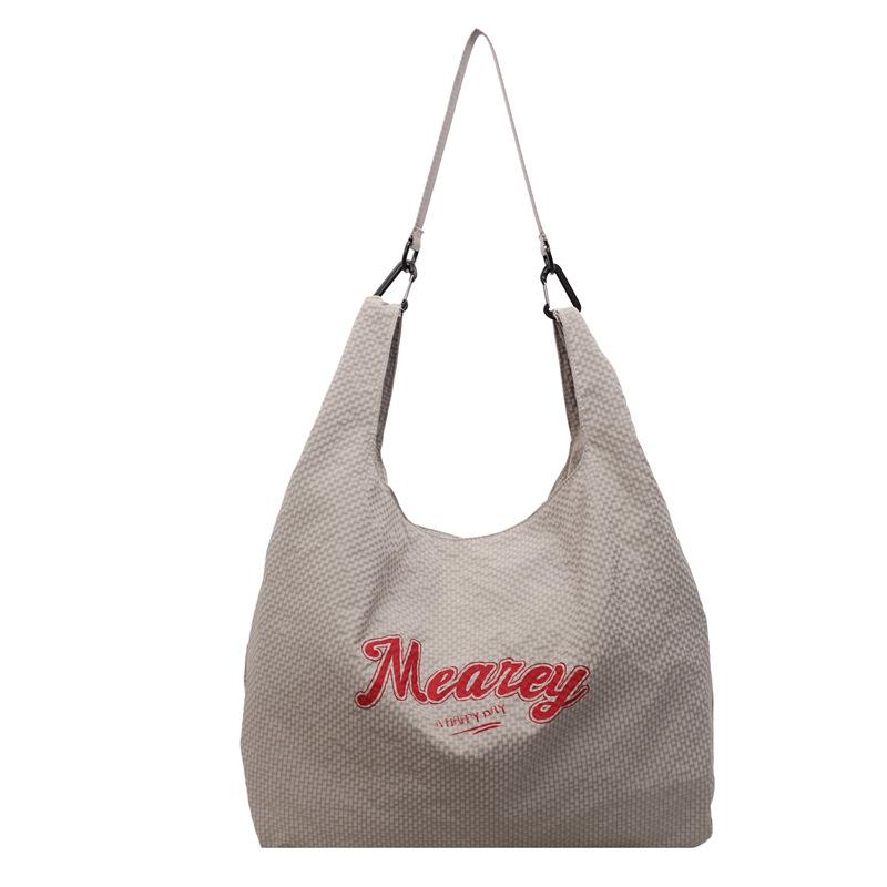 

Korean version of large-capacity canvas underarm bag women s 2025 autumn and winter new alphabet portable tote bag trendy versatile shoulder bag серый