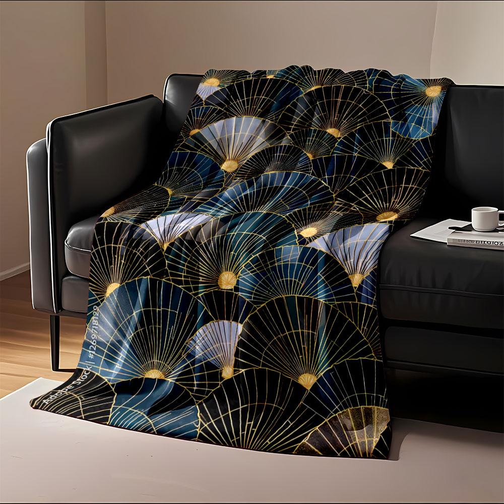 Overlapping fan shapes with gold lines and gradients of blue and black. for all seasons blanket lunch break throw gift