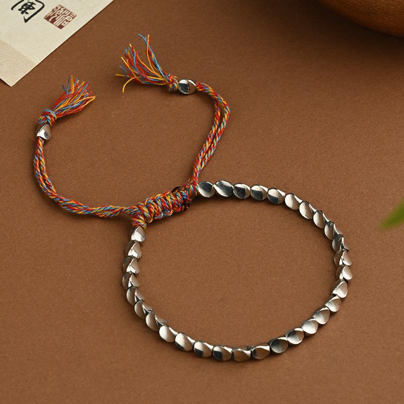 Handgemaakte Geweven Armband met Irreguliere Koperen Kralen en Creatief Kwastje Trekkoord