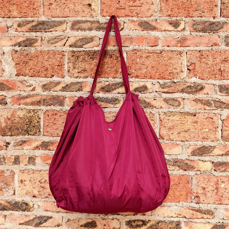Eco-Friendly Foldable Shopping Tote with Buckle, Drawstring Closure, and Single Shoulder Strap