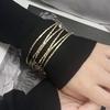This Simple and Fashionable Metal Texture Multi-layer Geometric Cross Round Women's Bracelet Exudes a Sense of High-end Design