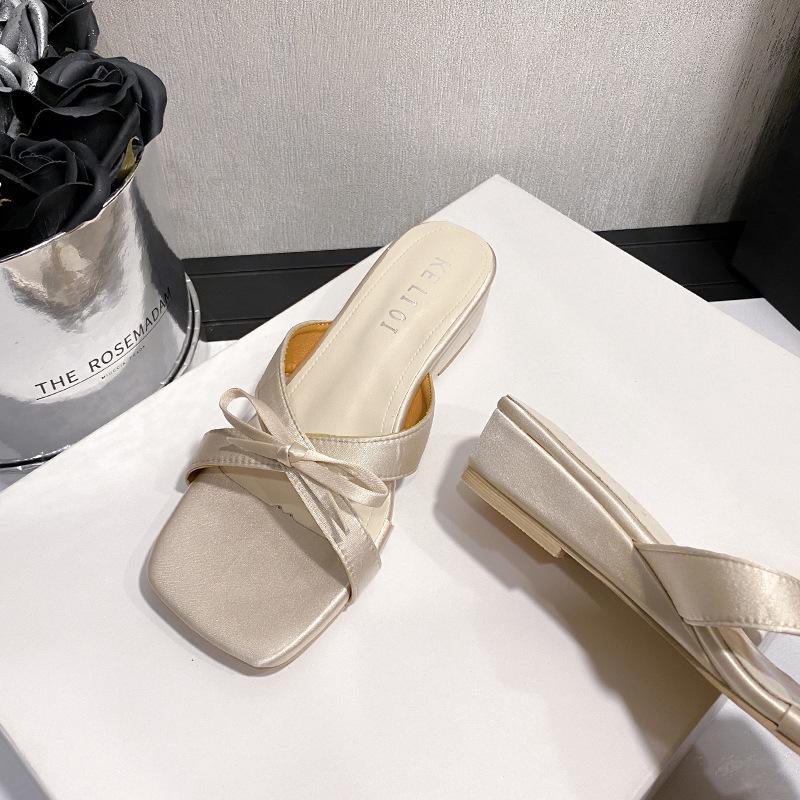 Fairy wind square head cross one-word cool slippers female summer wear 2025 new bow with skirt cool slippers