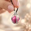 Ei-Schwangerschaftsbola mit rosa Glöckchen