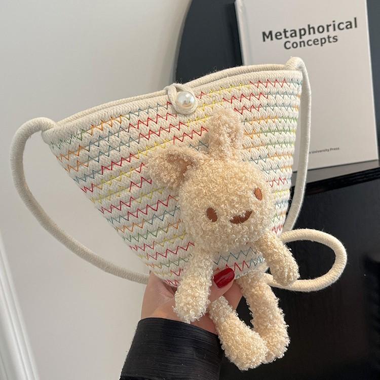 Summer cute oblique bucket bag women's straw woven outdoor travel beach bag versatile plush rabbit shoulder bag