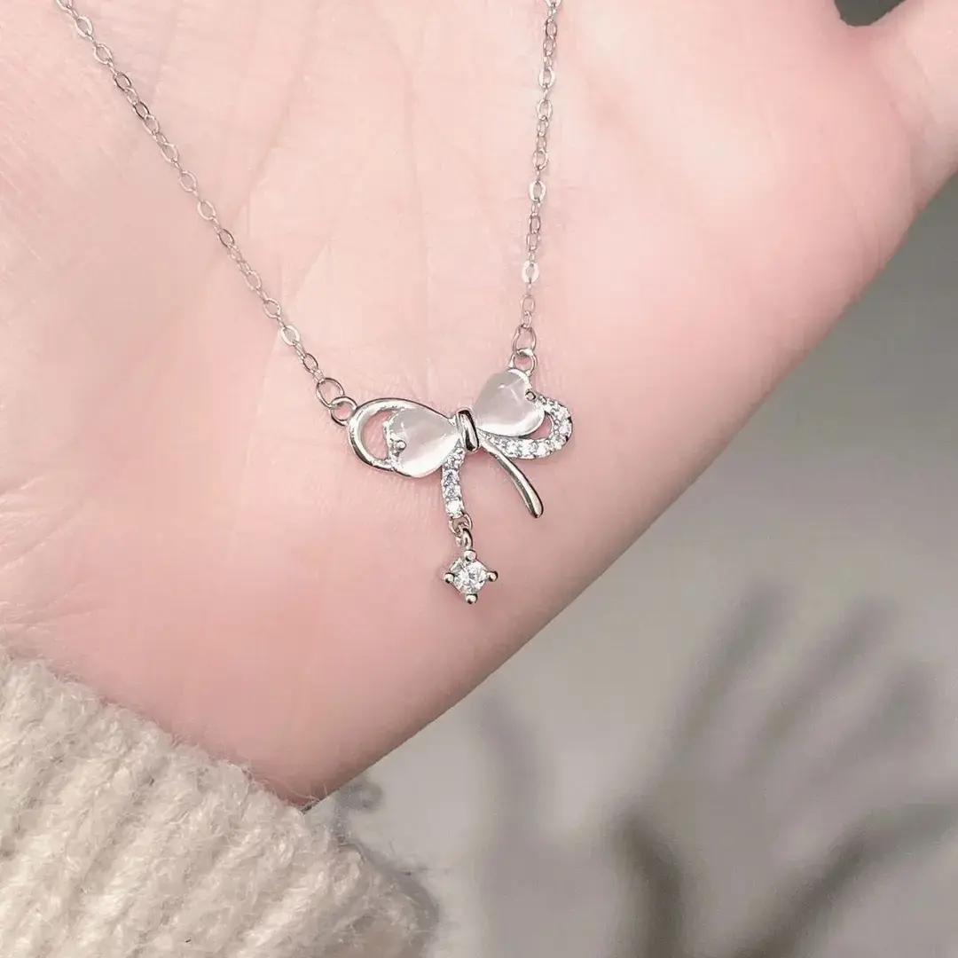 Cat s eye bow, fringed necklace, women s ins style niche design, girl s heart collarbone chain 2026 new wholesale