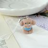Miniature Plush Teddy Bear Keychain with Soft Fabric Body and Metal Clip Attachment for Bags Backpacks and Keys Accessory