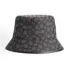 Coach Chapeau seau signature jacquard, logo classique C allover tissu recyclé large bord noir charbon luxe protection UV chapeau pêcheur