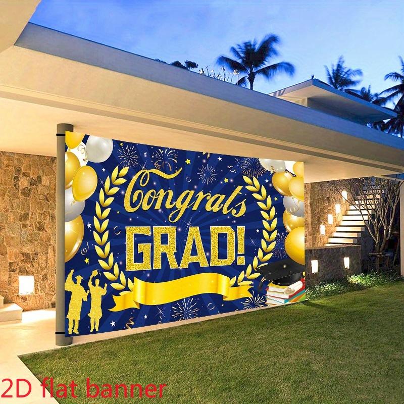 2D Plane A navy blue 2D plane banner with gold accents celebrating the graduates of 2026