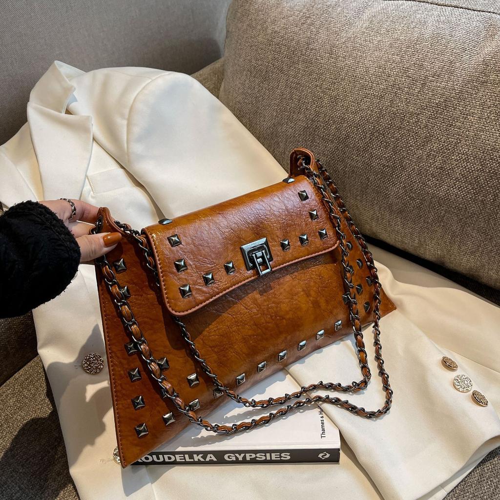 Retro rivet bag women's 2025 spring new textured chain portable shoulder messenger women's bag