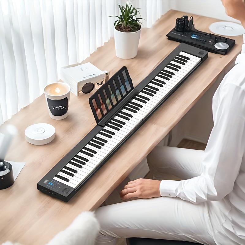 The 88-key electronic piano set | Black double-keyboard design, built-in stereo speakers, including backpack, sustain pedal, stand and charging cable