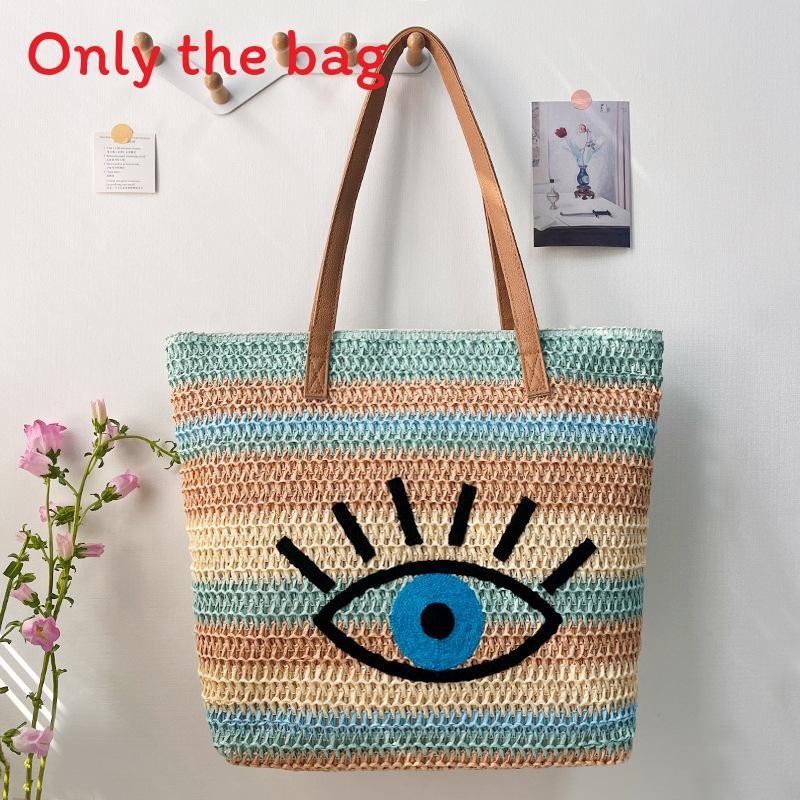 Große geflochtene Raffia-Strandtasche mit Augen-Print-Design und zwei Schultergurten für den Urlaub