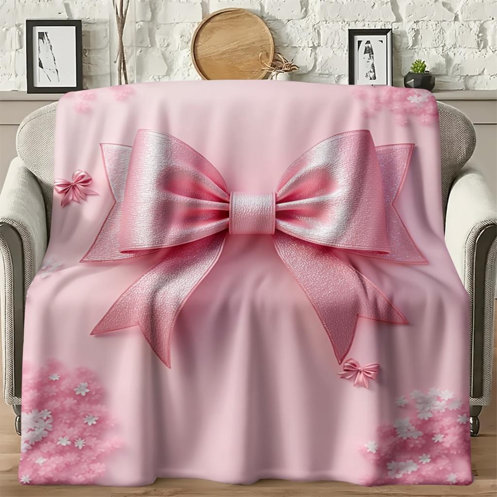 A Cozy Pink Flannel Blanket with a Bow Pattern - Soft and Warm, Perfect for Camping, Lounging On the Sofa, Bed, or Chair; a Grea