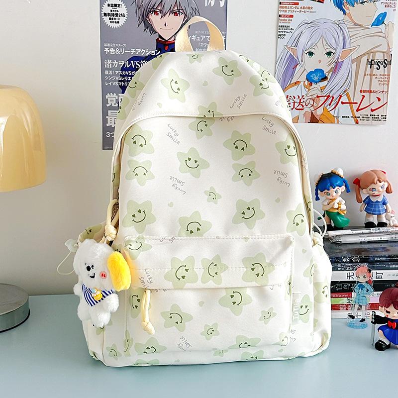 Nowy tornister jest wysokiej jakości, świeży, słodki i uroczy, a plecak w gwiazdki to lekki plecak podróżny dla uczniów gimnazjum.