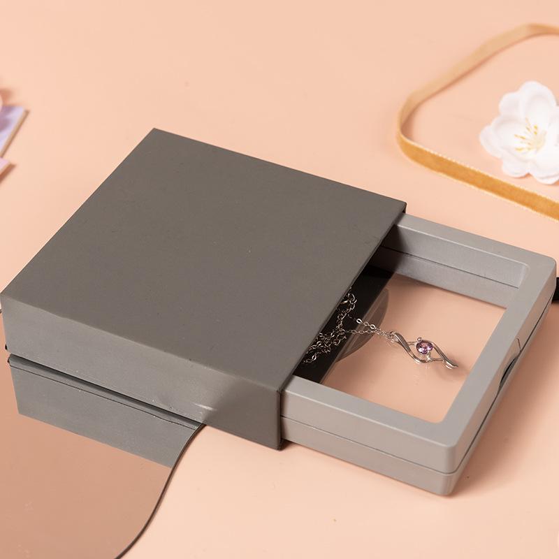 Aufbewahrungsbox für Nagelkunst mit PE-Folie und farbiger Kartenhülle