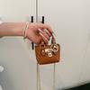 Korean version of girls' crossbody portable small square bag summer new personalized classic children's hand carry one shoulder crossbody bag