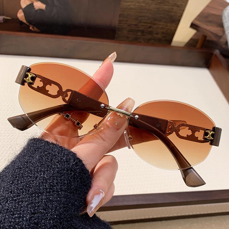 New Metal Frameless Edged Sunglasses For Women s Sun Protection Sunglasses Fashionable Hollow Elliptical Glasses 90309