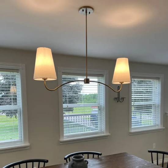 Brass Elegance with Linen Shade: A Timeless Chandelier for Distinctive Spaces