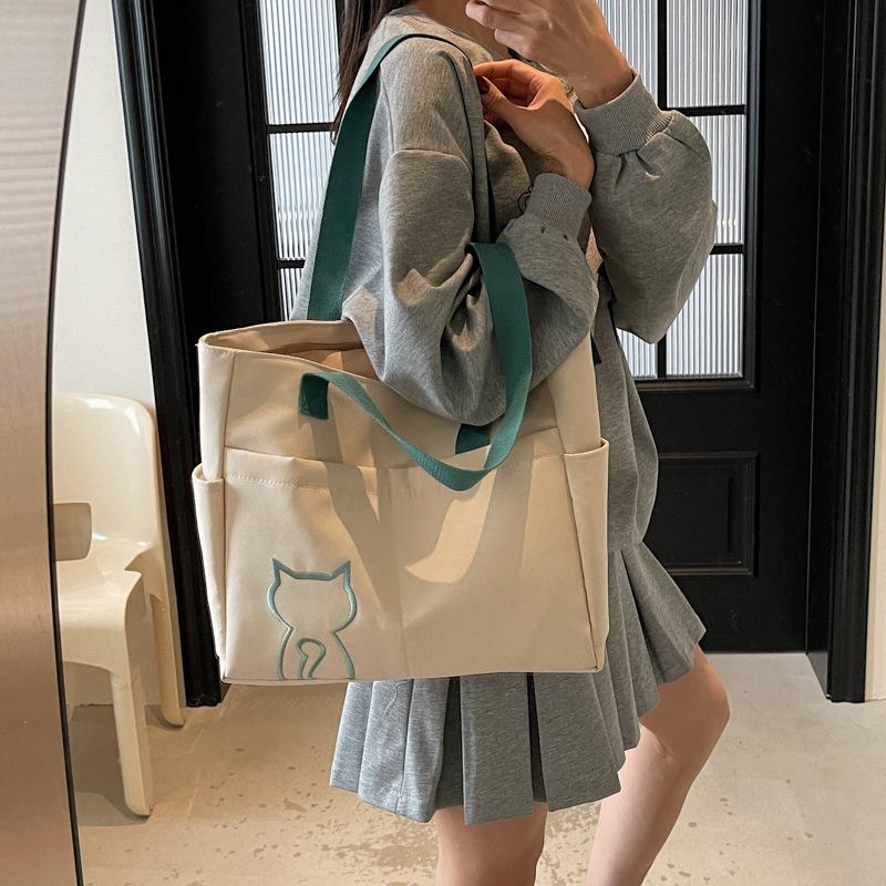 2025 new niche design women's bag on the street portable tote bag cute student messenger bag fashion shoulder bag women