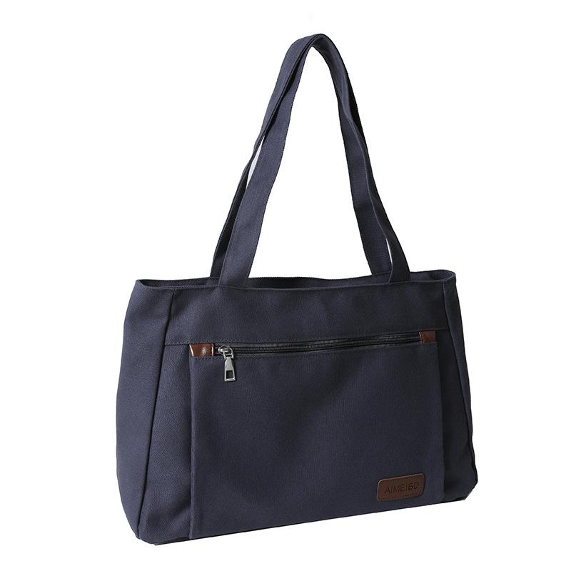 

Solid Color Canvas Tote Bag for Female Students Attending Classes and Tutoring, Large Capacity Commuting and Work Leisure Shoulder Bag синій