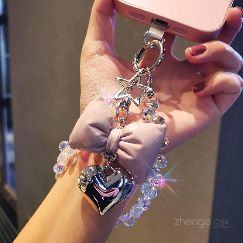 Small fragrance bow tie, love mobile phone hanging chain, ins mobile phone case, pendant, beaded chain, short fashion women's wrist ornament