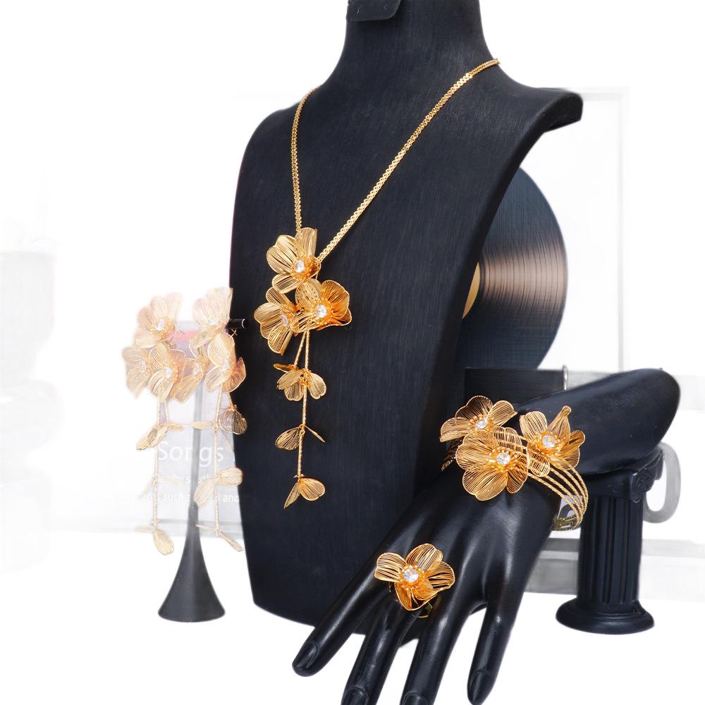 Exquisite 4-Piece Tassel Jewelry Set: Hollow Flower Necklace, Earrings, Bracelet & Ring