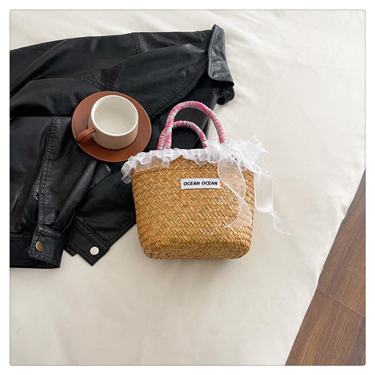 

Small fresh woven bag raffia large capacity straw woven bag women s seaside vacation portable vegetable basket bag рожевий