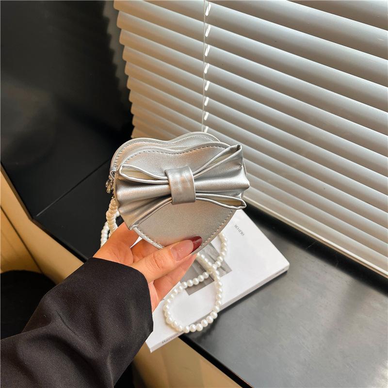 Summer new Korean version heart-shaped bow women's bag small bag foreign style shoulder bag solid color small bag messenger bag women