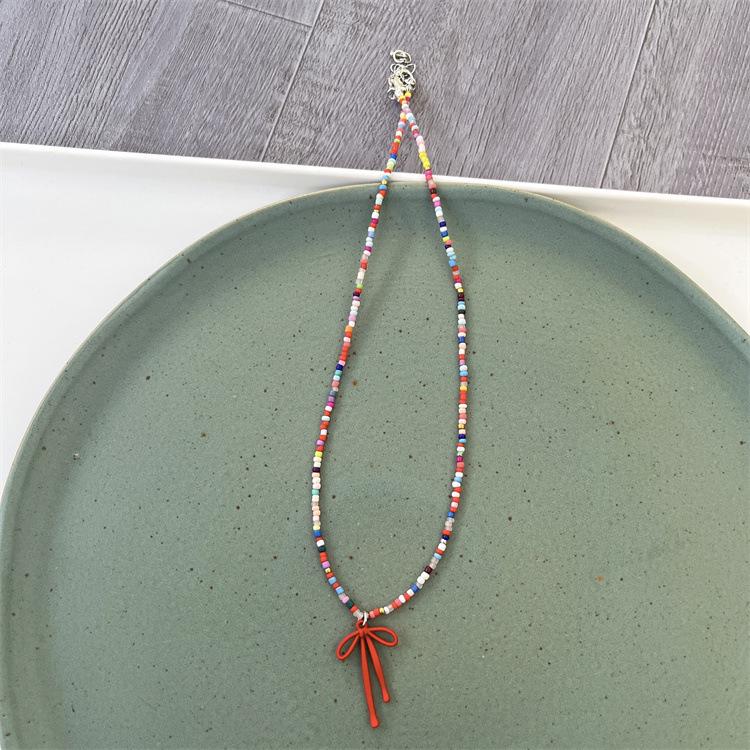 

Корейское роскошное ожерелье-бант из бисера: 2024 Женский Высококлассный Темпераментный Аксессуар для Ключицы красный