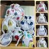 10pcs/lot Linen Drawstring pocket Cute Pattern Printed DIY wedding Candy Storage Bag Travel Makeup Cloth Shoes Sundries Storage