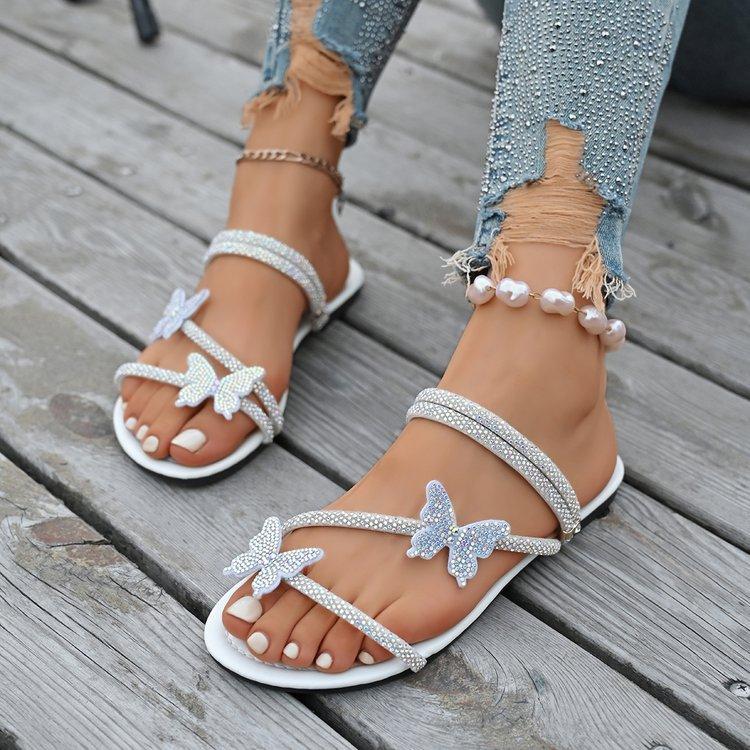 Cool slippers women's outer wear 2025 new summer butterfly rhinestone belt beach shoes versatile one-pedal flat sandals