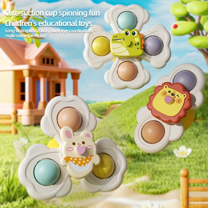 A Set of Three Cartoon Animal Suction Cup Spinning Tops for Babies, Designed To Enhance Hand-Eye Coordination During Early Education