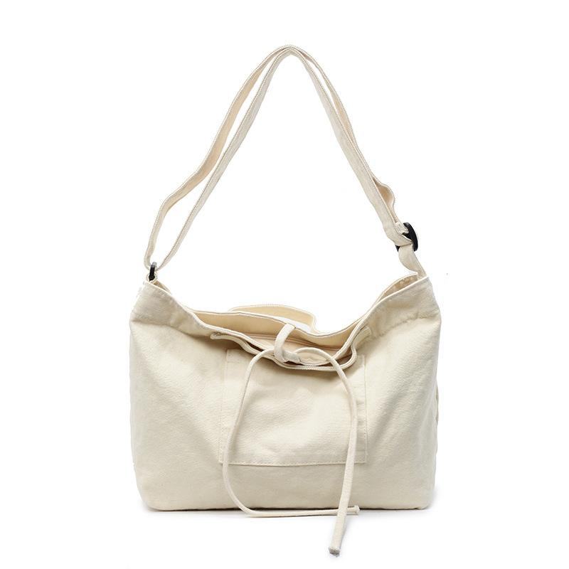 Stylish, simple and large-capacity cloth bag, new solid color shoulder bag, Korean version trendy portable messenger bag.
