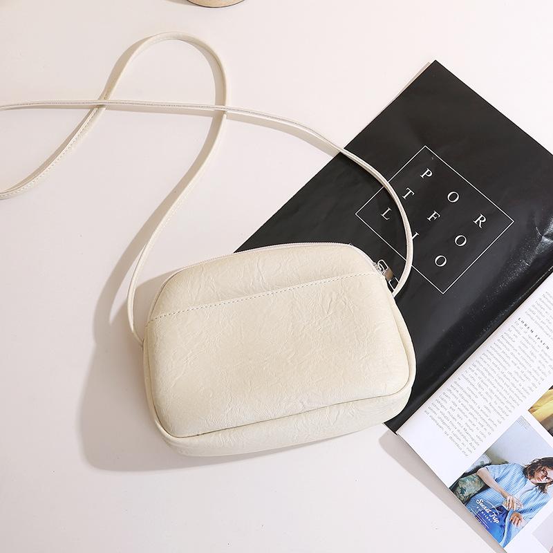 Retro women's simple soft pu leather small round bag solid color new style zip single-shoulder crossbody small bag daily handbag
