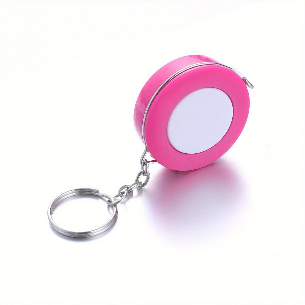 A Stylish Keychain Measuring Tape In Vibrant Colors, Featuring A 1.5-Meter Retractable Design, Perfect for Measuring Clothing Sizes
