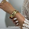 European & American Asymmetrical Glossy Fashion Bracelet with Curved Design