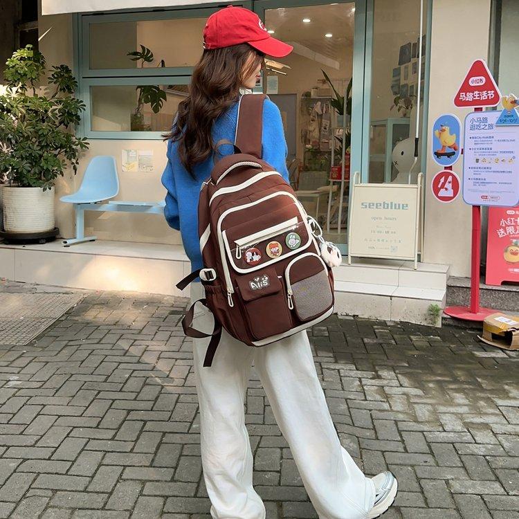 Schoolbag new junior high school student high school student schoolbag large capacity primary school student burden reduction ridge protection high