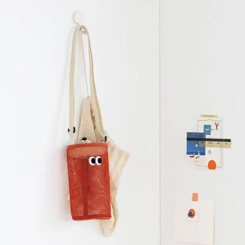 

Water cup bag cute big eyes drawstring bundle mouth water cup bottle storage bag women s shoulder oblique span mesh hollow small bag