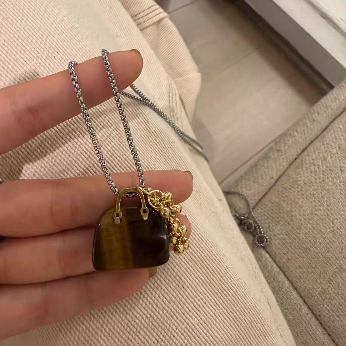 

Korean sweet cool style tiger s eye stone obsidian bag grape string necklace niche design sense versatile sweater chain necklace
