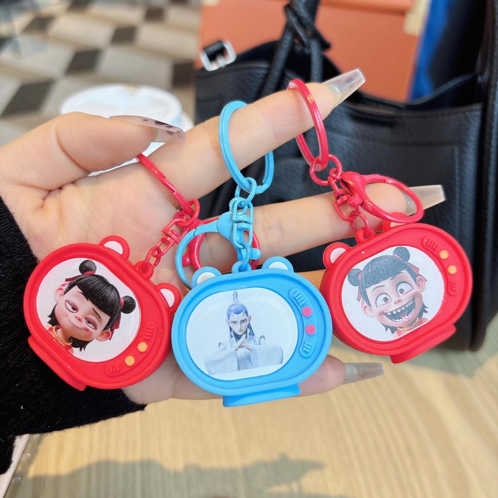 Nezha Luminous TV Keychain with Light - Student Backpack Pendant Ornament.